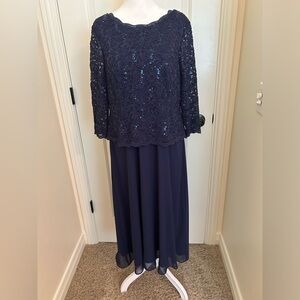 Navy 3/4 sleeve lace with sequins top with polyester skirt attached.